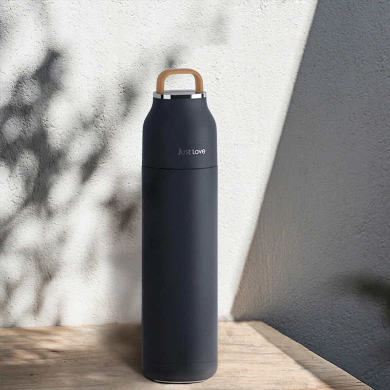 Stainless steel water bottle against a white background